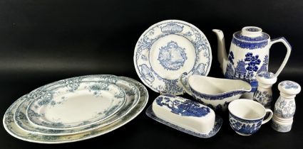 A collection of blue and white china including Willow pattern and meat plates, cups saucers, plates,