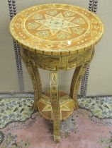A two-tier Moroccan parquetry inlaid occasional table raised on three shaped supports, 88cm high,
