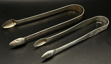 A group of five silver sugar tongs in various designs, 6 ozs approximately