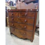 A Victorian mahogany bow fronted bedroom chest of two short over three long graduated drawers with