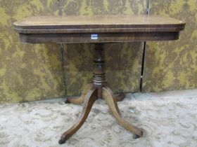 An early 19th century mahogany fold over top tea table of rectangular form with rounded corners,