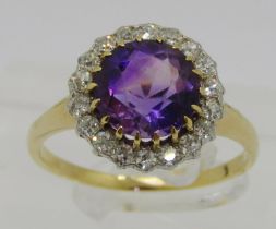 Mid-20th century yellow metal amethyst and diamond halo cluster ring, ring head 1.3cm diameter