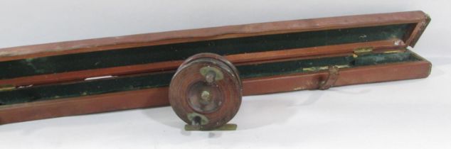 A leather fishing rod case, 160cm long, and a wooden vintage fishing reel with no maker’s mark.