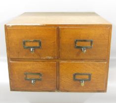 A 1930’s oak four drawer filing cabinet, 49cm x 40cm deep x 36cm high.