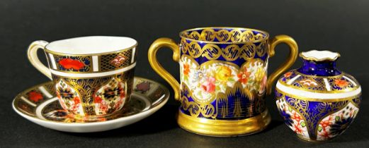 Crown Derby miniature cup and saucer with rich Imari detail, further miniature vase similarly
