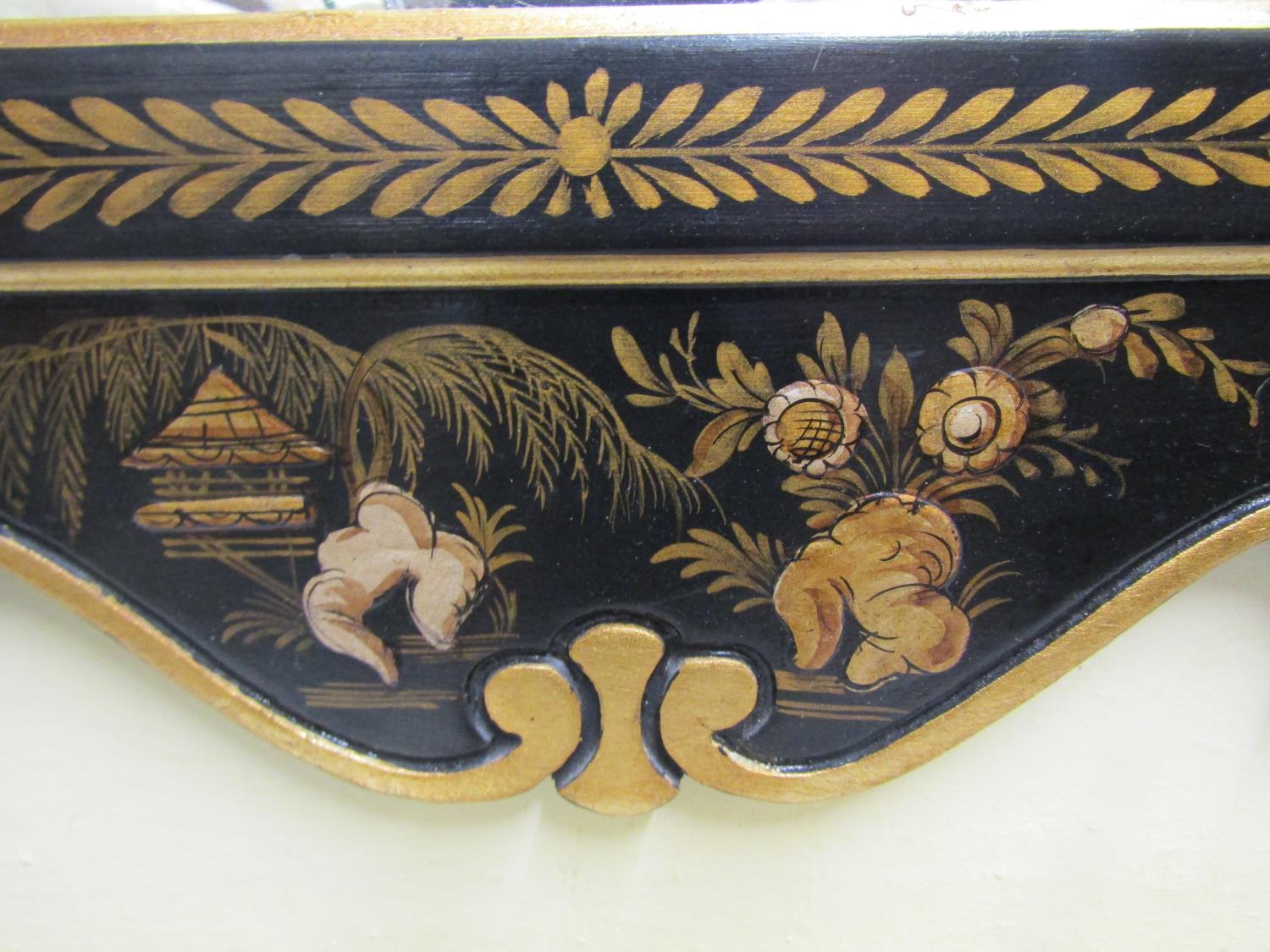 An 18th century style wall mirror with chinoiserie detail frame in black and gilt, set beneath a - Image 3 of 5