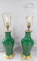 A pair of green porcelain vase lamps, possibly Chinese.