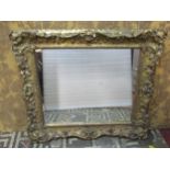 A 19th century swept and gilt moulded rectangular frame with scrolling acanthus and further