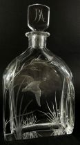 A cut glass Swedish Orrefors decanter with a flying duck amongst river plants, the initials RA