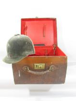 A Vintage Leather hat box containing a vintage Patey horse riding helmet.