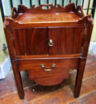A Georgian mahogany tray top commode, enclosed by two doors on moulded supports, 56cm wide x 48cm