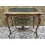 A late 19th century French writing table with inset leather top and serpentine moulded outline