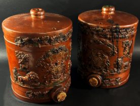 A pair of salt glazed spirit barrels with applied royal cypher, lion and trailing vine leaf