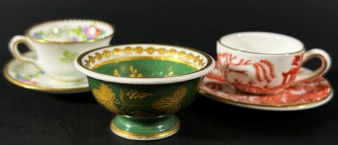 A miniature Minton cup and saucer with floral garlands, further miniature Coalport ironstone red