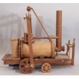 Working scratch-built model of an early steam locomotive, all hand made in teak with switch operated