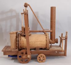 Working scratch-built model of an early steam locomotive, all hand made in teak with switch operated