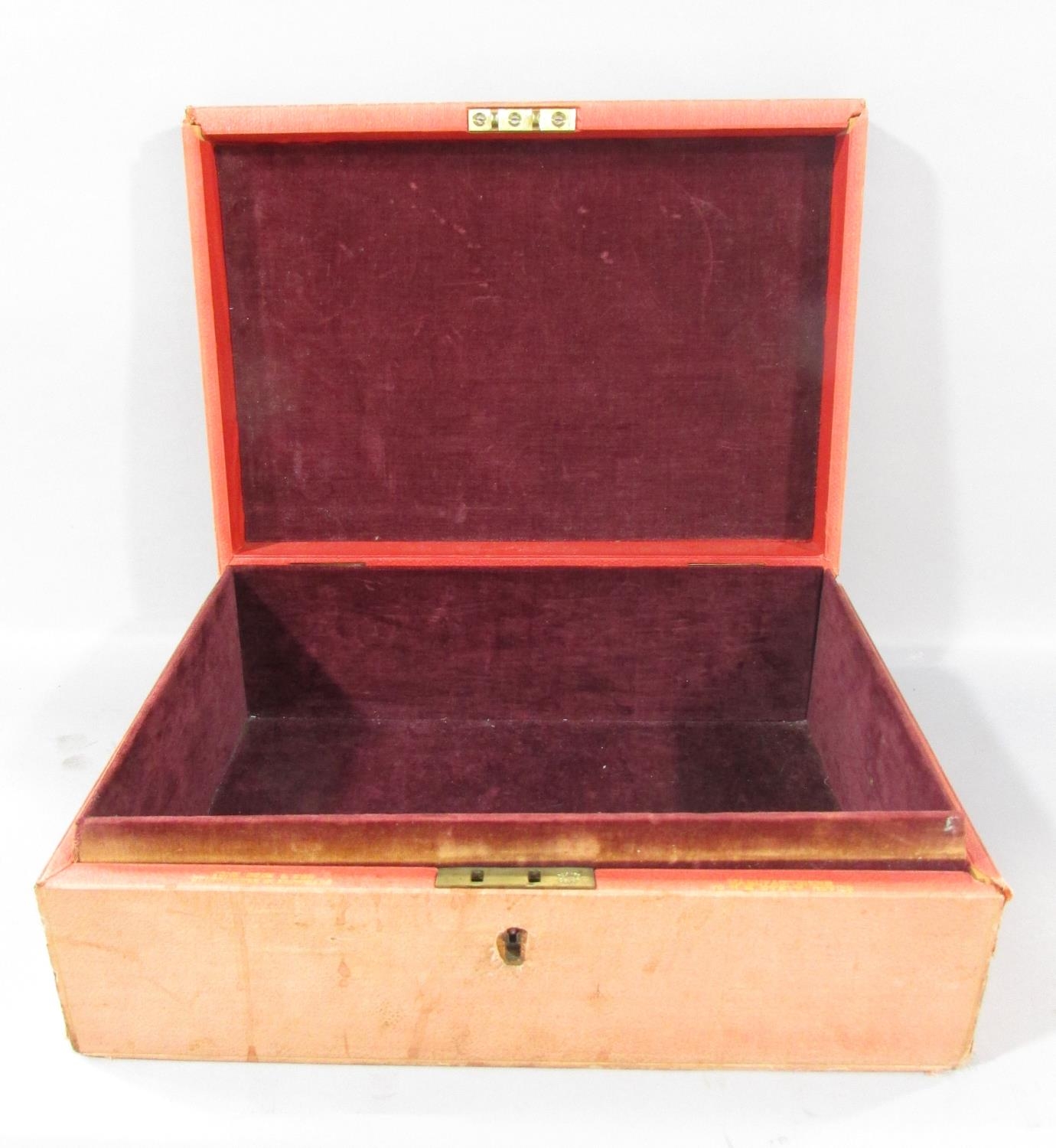 A distressed red Minister’s Document Box bearing the Royal Coat of Arms to the lid.
