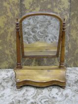 A Victorian toilet mirror with arched plate raised on turned column supports and hinged box base