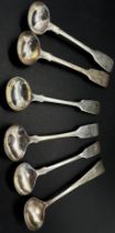 A silver group of twelve mustard spoons in mixed designs, 4.8 ozs approximately