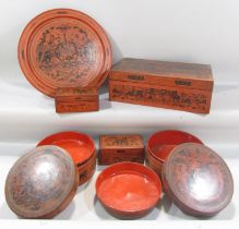 A collection of five Burmese red lacquered ware, two circular boxes, a single rectangular box and
