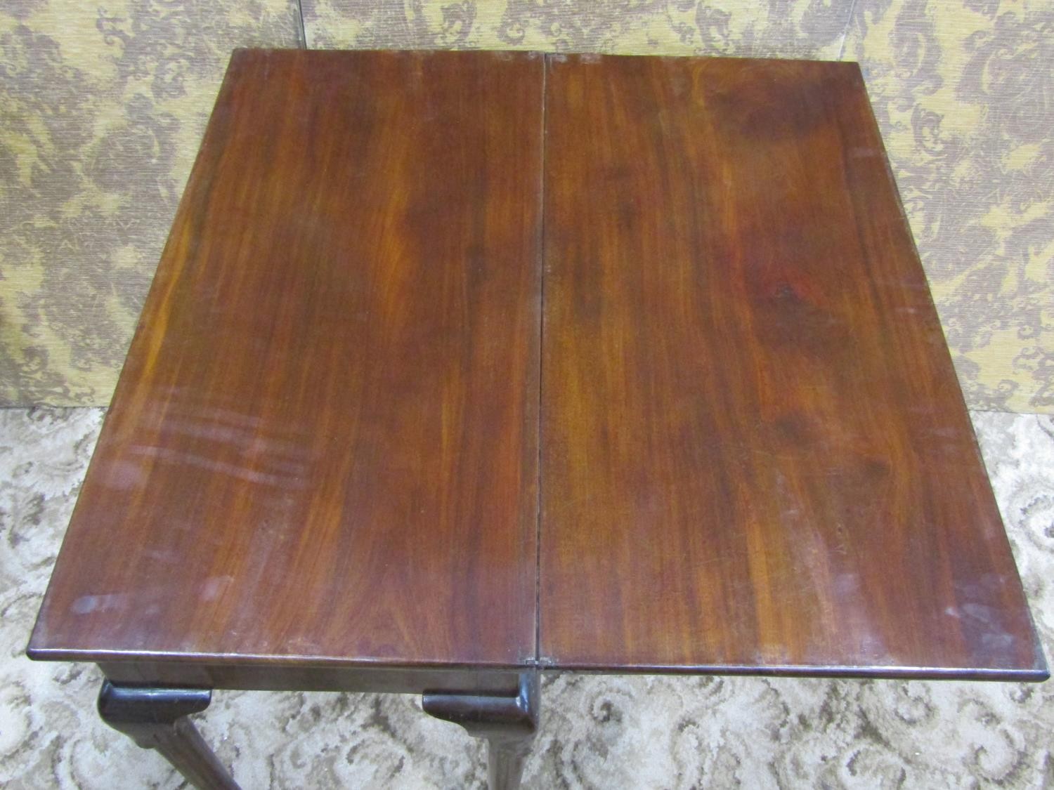 A Georgian mahogany rectangular fold over top tea table with central frieze drawer raised on - Image 4 of 4