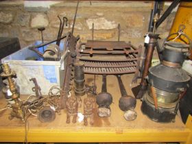 A large selection of various items comprising an iron fire basket, two large bell clappers,