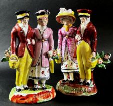Two Staffordshire pearlware figure groups, each depicting a dandy and dandizette in Regency dress,