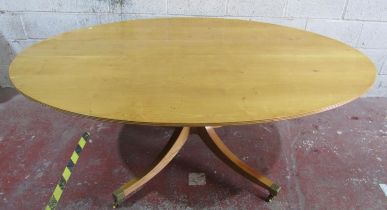 A good quality contemporary but Regency style chestnut and oak breakfast table of oval form by