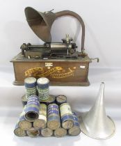 An Edison Home Phonograph (A/F) with a selection of sixteen wax cylinder recordings.