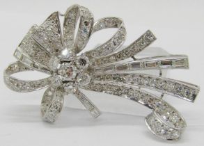 Good quality circa 1950s vari-cut diamond ribbon spray brooch in white metal (probably platinum),