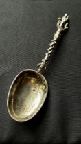 An 18th century Dutch silver christening spoon with shaped and pierced handle, surmounted