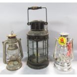 A 19th century metal five glass panel storm lamp with a single candle holder, a later oil