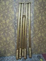 Five gilded timber curtain pole with fluted finials and rings, 4 x 215cm long 1 x 170cm long