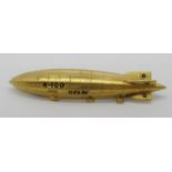 9ct brooch modelled as the British airship R100, maker 'J.B&Co Ld', 5.5cm W approx, 5.1g