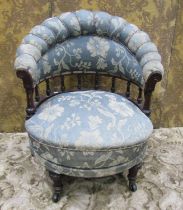 A Victorian tub chair with carved spindle mouldings and swivel framework, probably marine