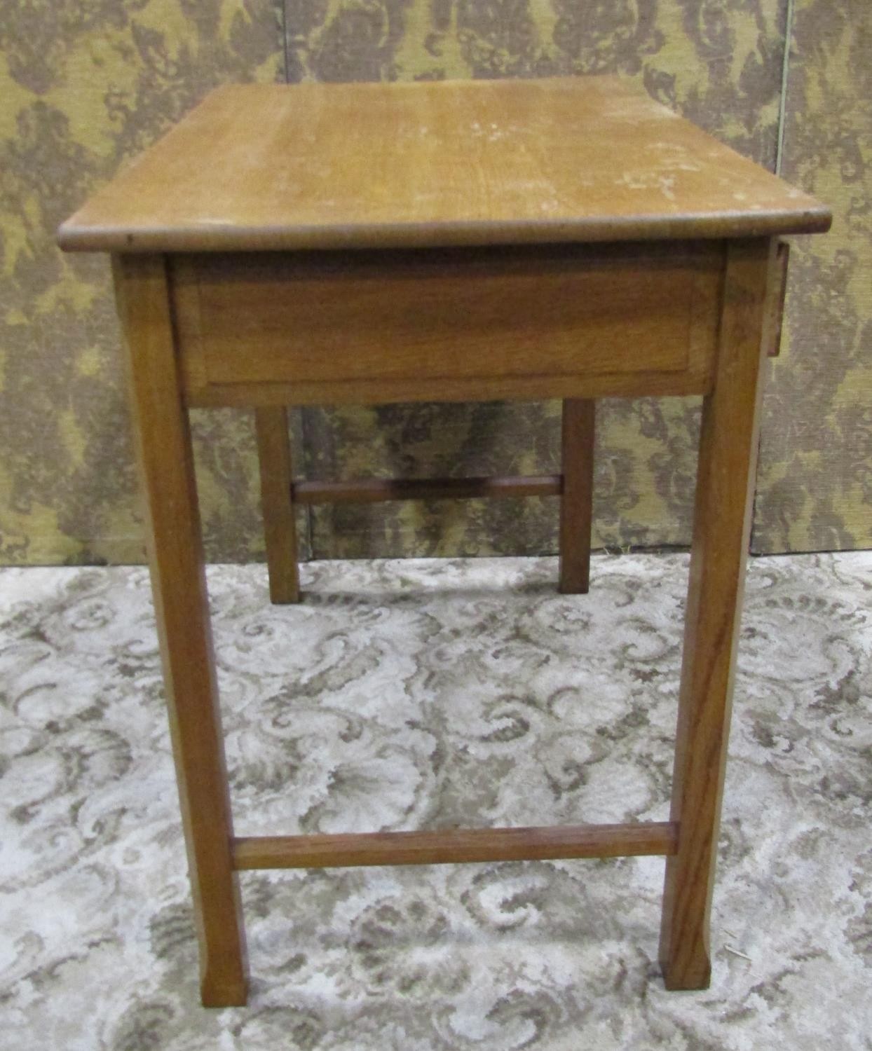 An Arts & Crafts oak side table with shallow frieze drawer raised on square cut and moulded - Image 4 of 7
