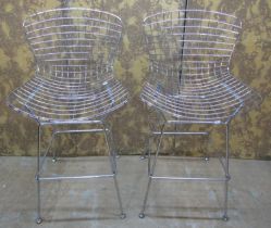 A pair of contemporary chrome Burtola style wire highchairs on splay supports