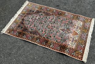 A small Persian prayer mat with an all over floral pattern, 130cm x 80cm, an old Bokhara carpet with