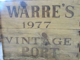 A wooden case of twelve bottles of Warre’s 1977 Vintage Port.