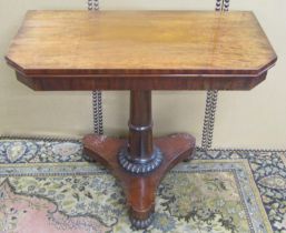 A Regency mahogany fold over card table with canted corners, raised on a tapering column and tricorn