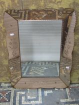 A Venetian mirror of rectangular form with peach coloured mirrored framework, 70cm x 54cm