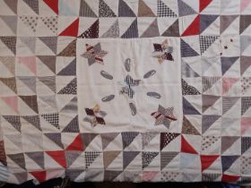An unfinished patchwork quilt project; an early 20th century hand stitched patchwork panel in fine