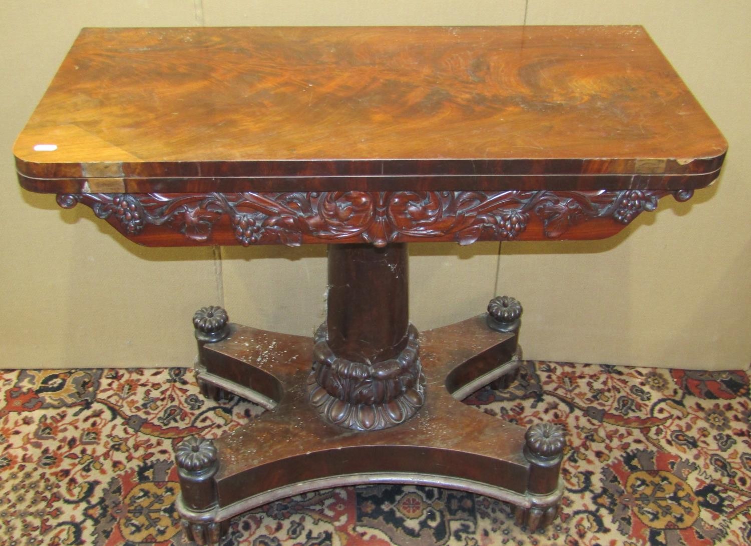 A William IV carved tea table on platform base