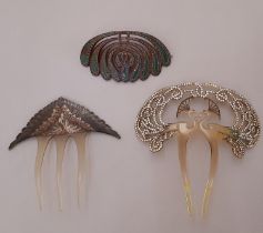 Three early 20th century Art Nouveau style hair accessories comprising a hair comb in the form of