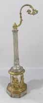 A Reeded Column Street Lamp watch stand set on a base with bronze cherubs in relief.