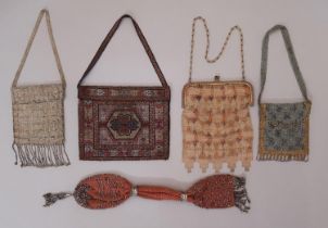 4 early 20th century purses including a fine mesh purse with metal clasp and castellated lower
