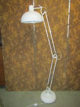 A retro style floor standing anglepoise lamp