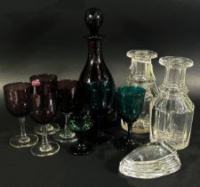 A late Victorian purple glass decanter with a set of inter matching purple and green glasses, a 19th