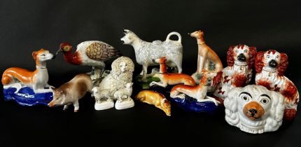 A collection of Staffordshire figures to include Spaniels, Greyhounds, Poodles, etc, further 19th