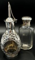 A mixed collection of silver vanity sets including cotton wool bottle, a perfume bottle, all with